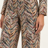 Close-up of the Héloïse Multico Chevron pants waistband, side pocket and jacquard texture