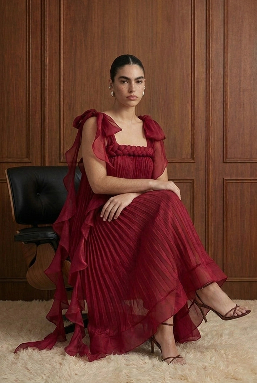 Merlot Rêverie Bow-Shoulder Pleated Maxi Dress in Wine — seated view