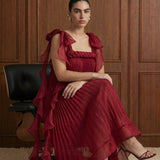 Merlot Rêverie Bow-Shoulder Pleated Maxi Dress in Wine — seated view