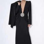 Noir Solstice long-sleeve black maxi dress styled with a blazer