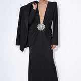 Noir Solstice long-sleeve black maxi dress styled with a blazer