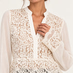 Close-up of Georgette Lace Blouse floral lace neckline and scalloped cuff