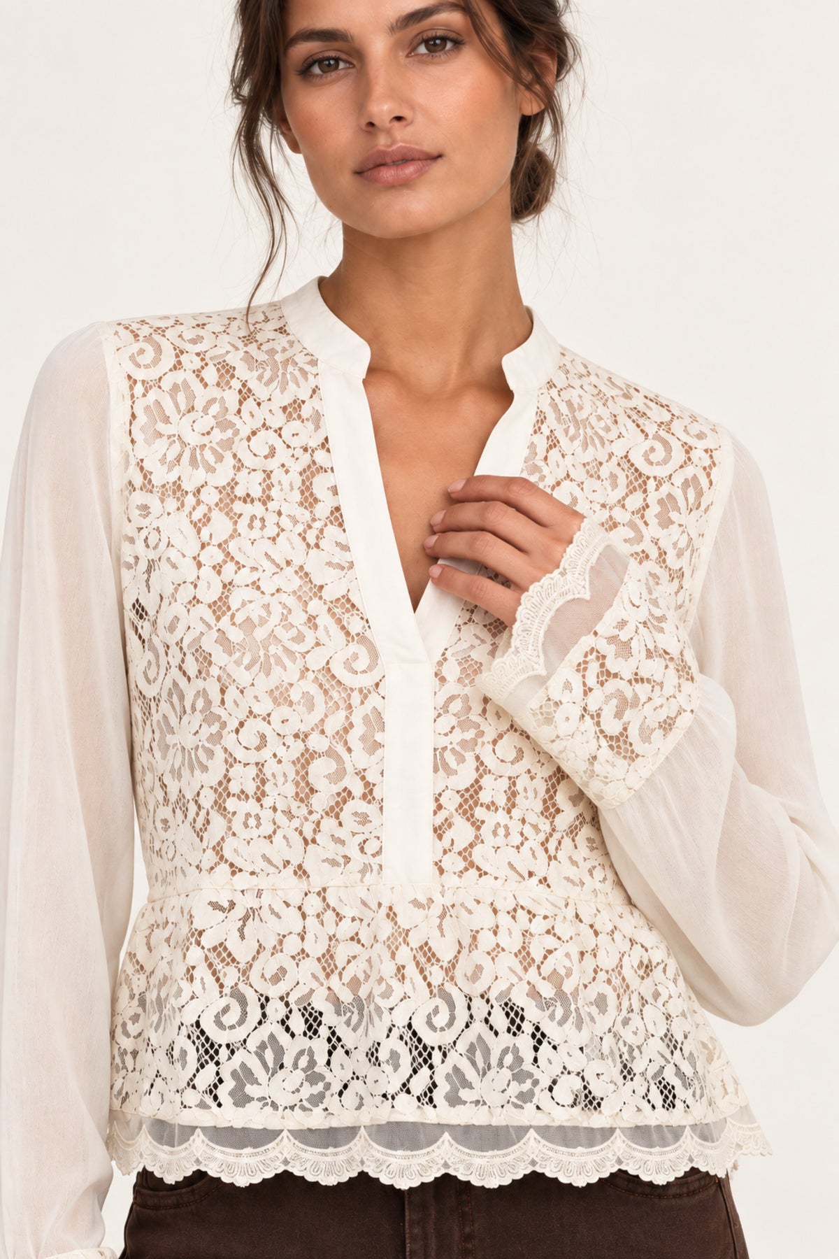 Close-up of Georgette Lace Blouse floral lace neckline and scalloped cuff