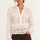 Front view of Georgette Lace Blouse in ecru on model with brown jeans