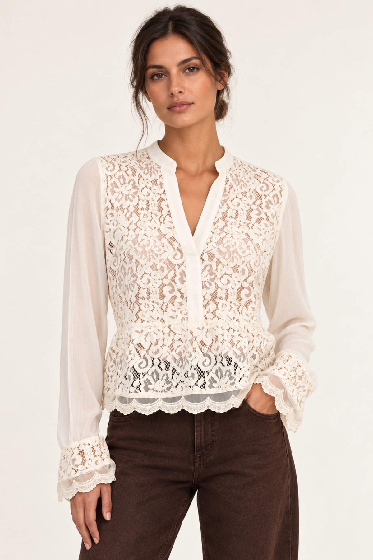 Front view of Georgette Lace Blouse in ecru on model with brown jeans