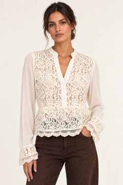Front view of Georgette Lace Blouse in ecru on model with brown jeans