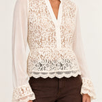 Half shot of Georgette Lace Blouse in ecru showing floral lace front and scalloped hem