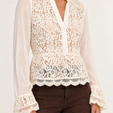 Half shot of Georgette Lace Blouse in ecru showing floral lace front and scalloped hem