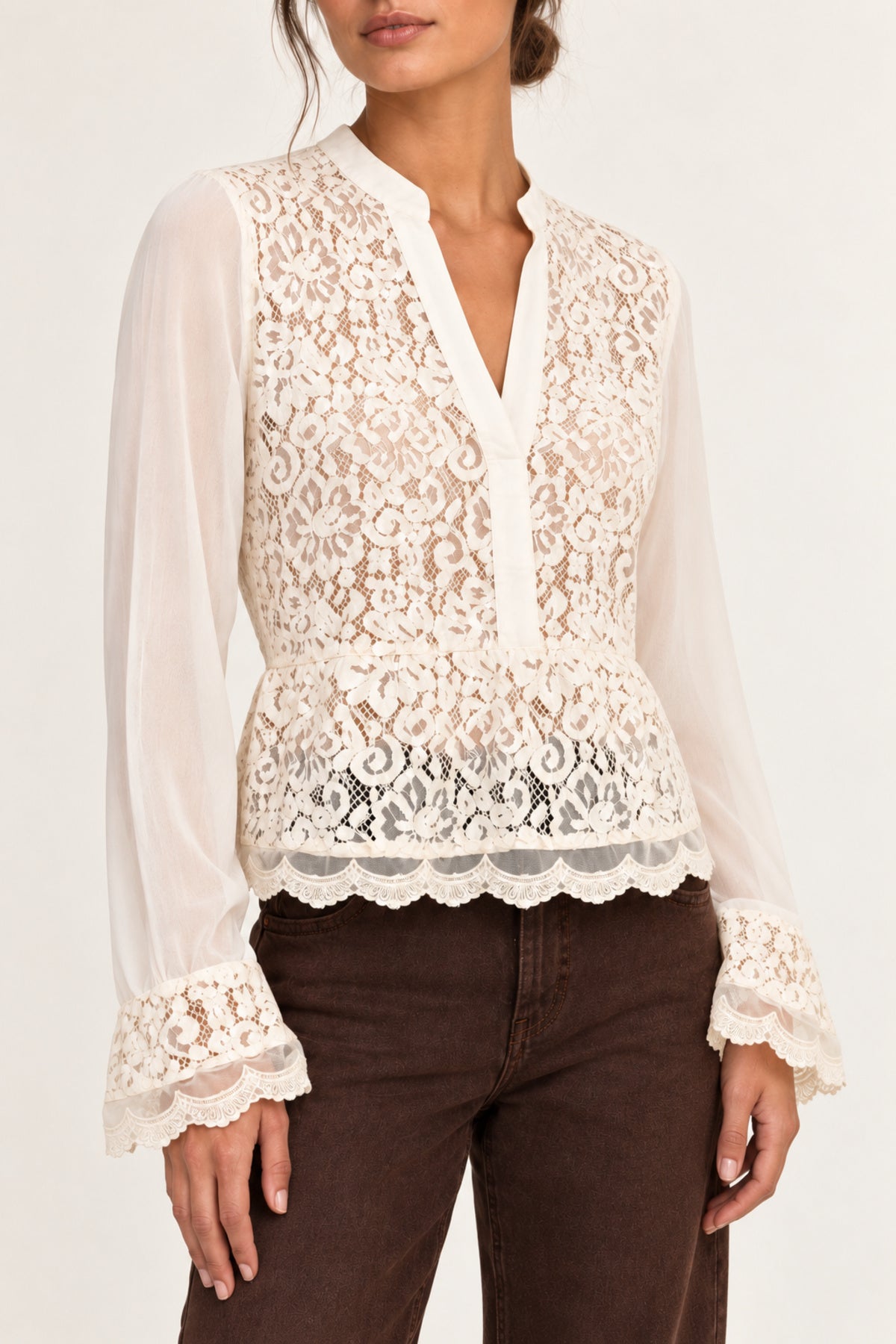Half shot of Georgette Lace Blouse in ecru showing floral lace front and scalloped hem