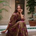 Olive Roseraie flowing floral skirt set, seated view