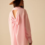 oversized baby pink shirt with bow in the back
