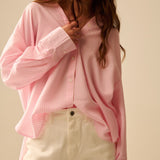 oversized baby pink shirt with bow in the back