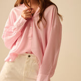 oversized baby pink shirt with bow in the back