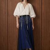 Perle Cascade Pleated Midi Skirt — blue front view