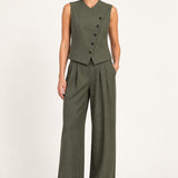 Perrine military olive pleated wide-leg pants, front view on a model against an ivory studio background