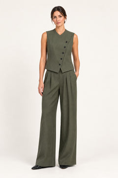 Perrine military olive pleated wide-leg pants, front view on a model against an ivory studio background