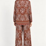 Séverine Passila Chocolate pants, back model view on an ivory studio backdrop