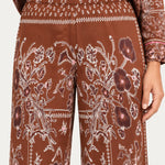 Séverine Passila Chocolate pants, elastic waistband close-up on an ivory studio backdrop