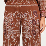 Séverine Passila Chocolate pants, elastic waistband close-up on an ivory studio backdrop