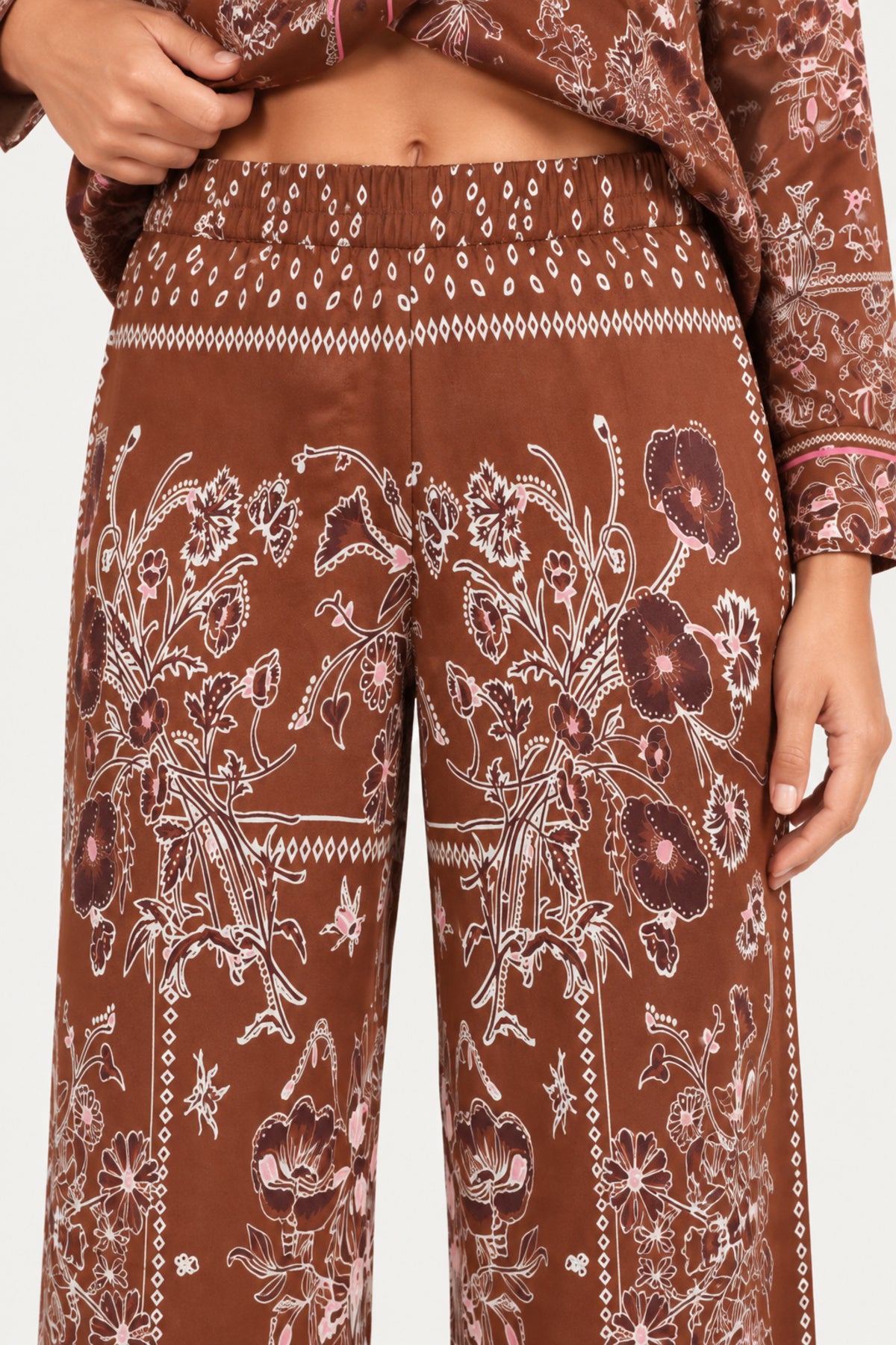 Séverine Passila Chocolate pants, elastic waistband close-up on an ivory studio backdrop