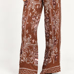 Séverine Passila Chocolate pants, full-leg detail view on an ivory studio backdrop