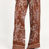 Séverine Passila Chocolate pants, full-leg detail view on an ivory studio backdrop