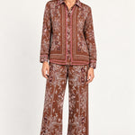 Séverine Passila Chocolate pants, front model view on an ivory studio backdrop