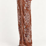 Séverine Passila Chocolate pants, side model view on an ivory studio backdrop