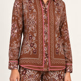 Séverine Passila Chocolate shirt, half-length detail view on an ivory studio backdrop