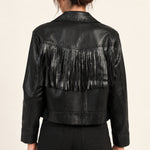 Sidonie fringe faux-leather jacket in Black, back view showing fringe on an ivory studio backdrop