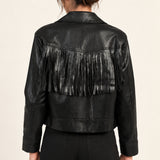 Sidonie fringe faux-leather jacket in Black, back view showing fringe on an ivory studio backdrop