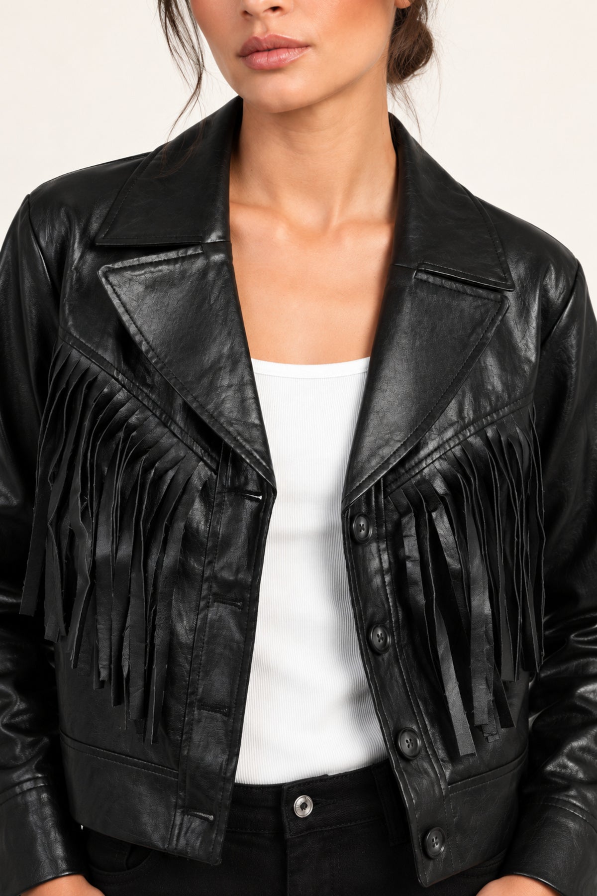 Sidonie fringe faux-leather jacket in Black, close-up of lapels and fringe on an ivory studio backdrop