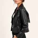 Sidonie fringe faux-leather jacket in Black, side view on an ivory studio backdrop