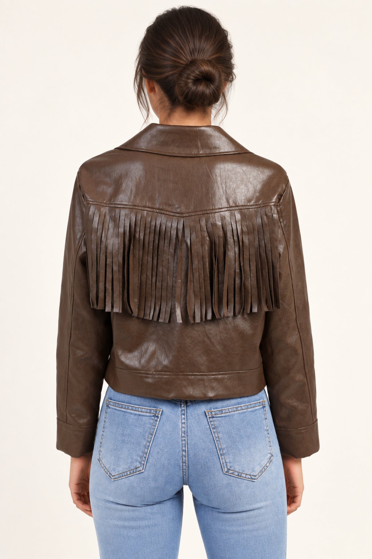 Sidonie fringe faux-leather jacket in Coffee, back view showing fringe on an ivory studio backdrop