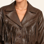 Sidonie fringe faux-leather jacket in Coffee, close-up of lapels and fringe on an ivory studio backdrop