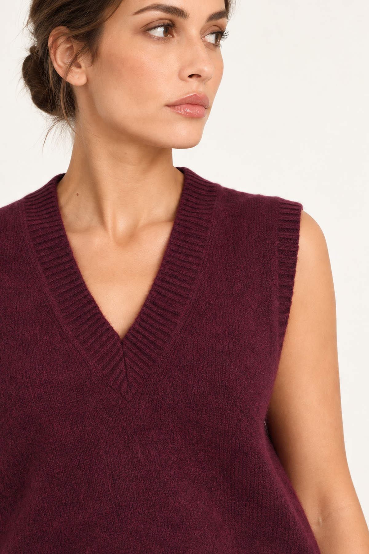 Solène burgundy sweater vest with floral trousers — close-up
