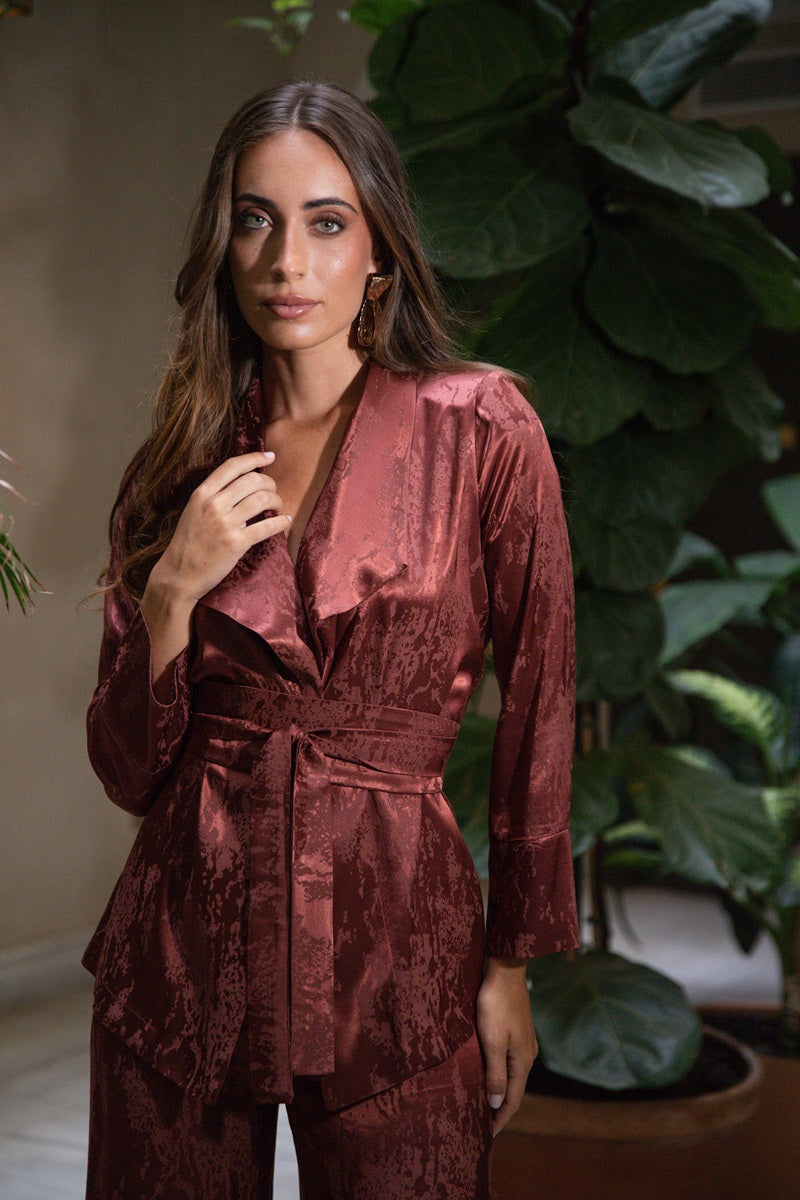Terracotta Reverie wrap jacket with fluid lapels and waist tie